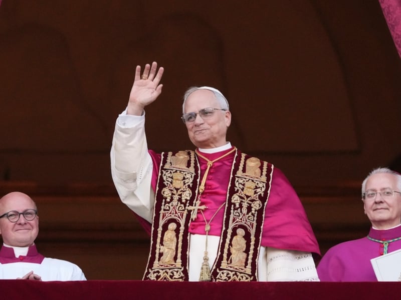Cardinal Robert Prevost appears on the central loggia of St. Peter's Basilica after being...