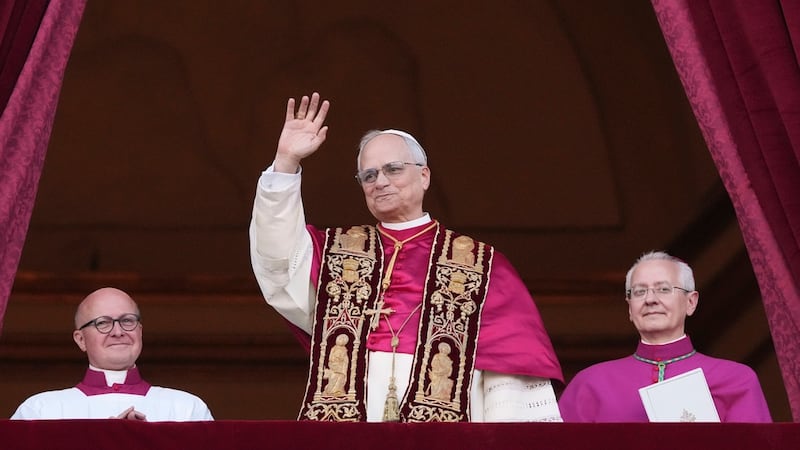Cardinal Robert Prevost appears on the central loggia of St. Peter's Basilica after being...