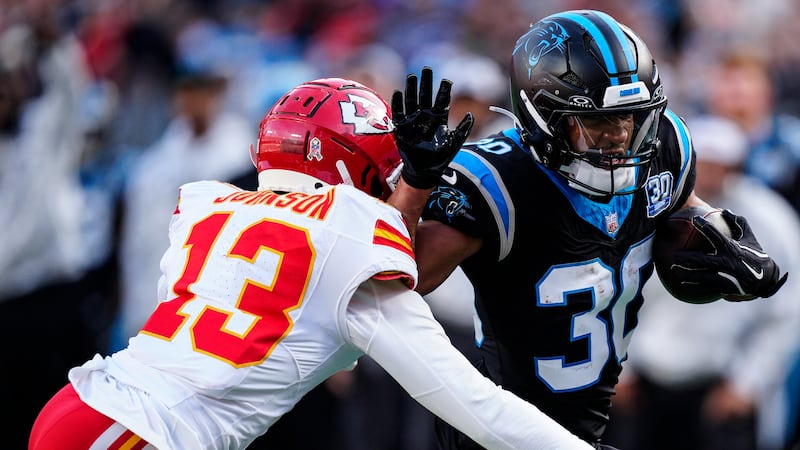 Carolina Panthers running back Chuba Hubbard (30) runs against Kansas City Chiefs safety...