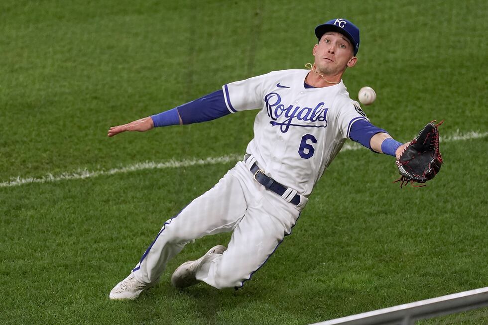 Kansas City Royals right fielder Drew Waters misses a fly foul ball hit by Cleveland...