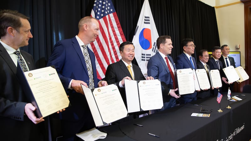 University of Missouri administrators and company leaders from South Korea sign a new agreement.