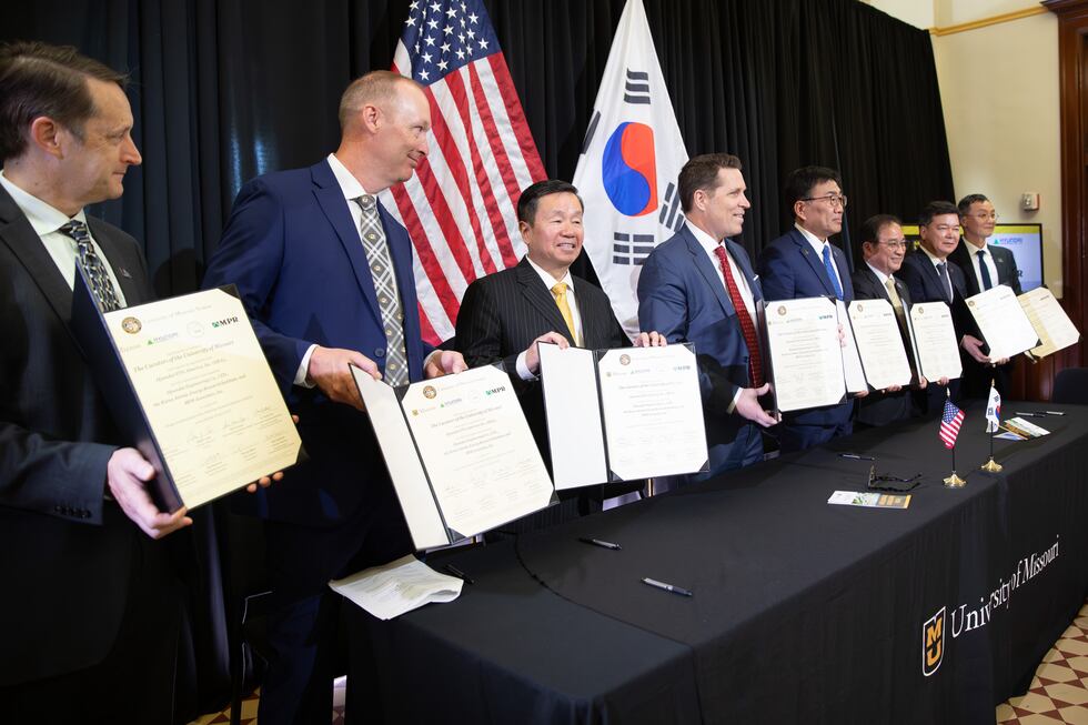 University of Missouri administrators and company leaders from South Korea sign a new agreement.