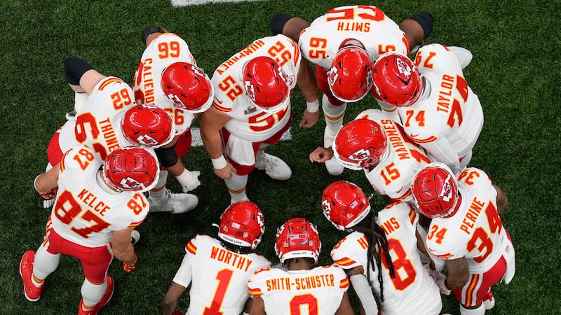 Kansas City Chiefs quarterback Patrick Mahomes (15) calls a play in the huddle during the...