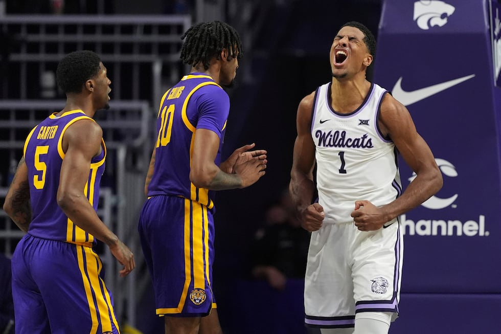 Kansas State guard David N'Guessan (1) celebrates after making a basket during the first half...